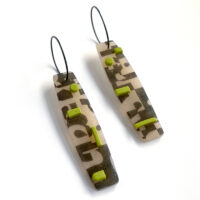Type collage earrings with green accents. Polymer clay and sterling silver. Jane Pellicciotto