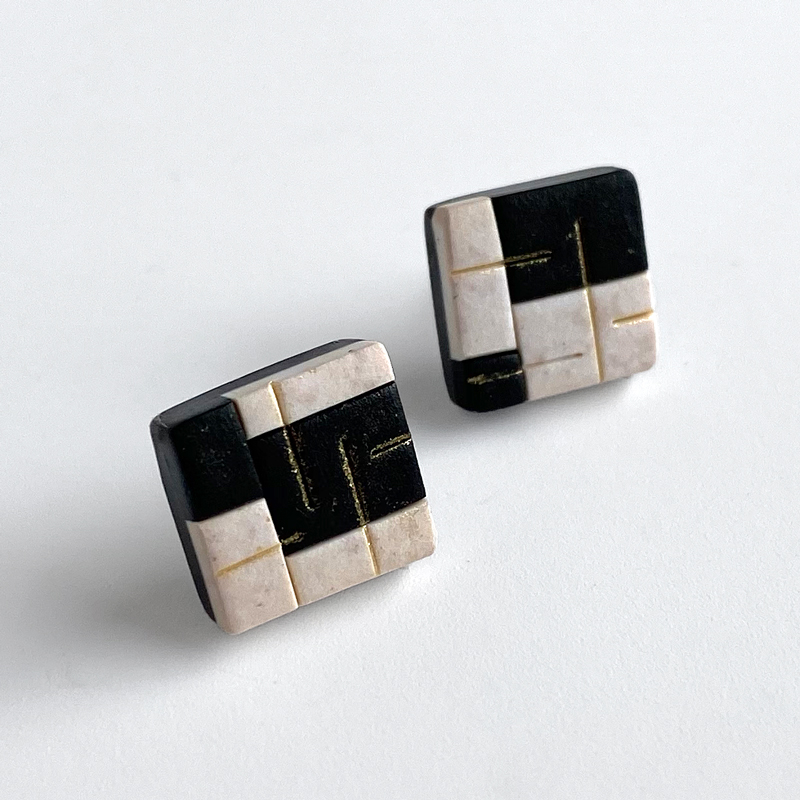 Black and white polymer clay post earrings with gold dust. Jane Pellicciotto