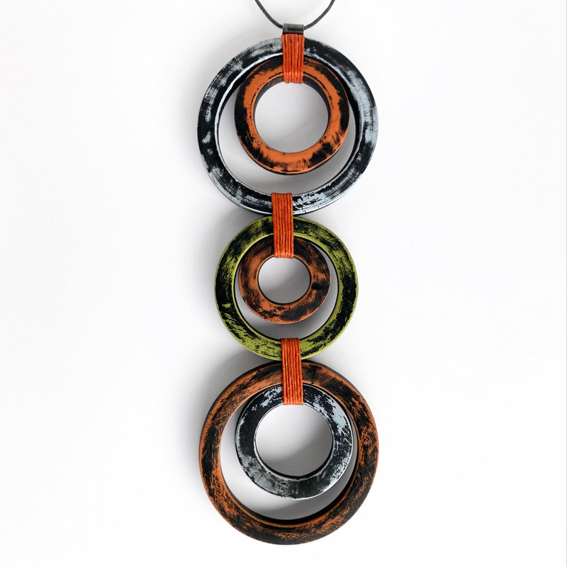 Cirque Pendant. Polymer clay, linen thread, acrylic paint. Jane Pellicciotto