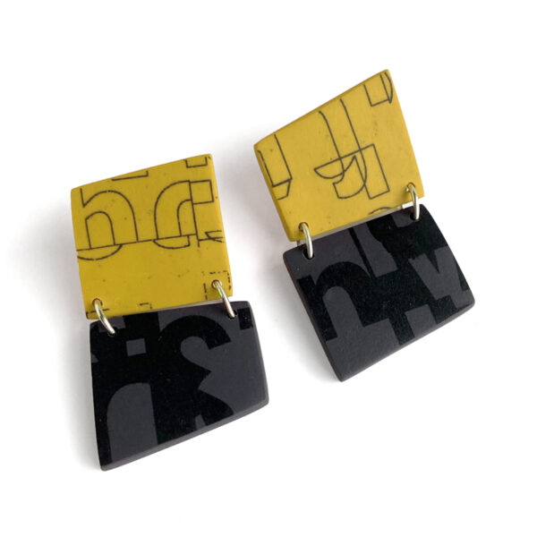 Hinged typographic polymer clay earrings. Jane Pellicciotto