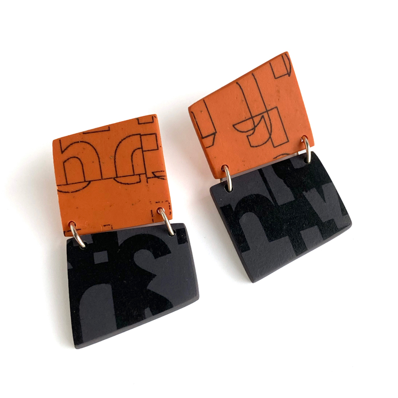 Hinged typographic polymer clay earrings. Jane Pellicciotto