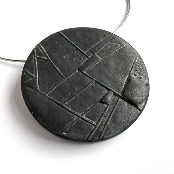 Polymer clay textured disc pendant/brooch. Jane Pellicciotto